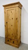 AN ANTIQUE WAXED PINE SINGLE DOOR ONE DRAWER WARDROBE, W 86CM, D 46CM, H 200CM.