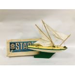 A VINTAGE BOXED STAR YACHT POND YACHT