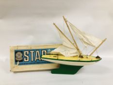 A VINTAGE BOXED STAR YACHT POND YACHT