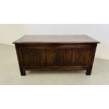 A REPRODUCTION OAK FINISH BLANKET CHEST WITH LINEN FOLD PANEL DETAIL LENGTH 105CM. DEPTH 47CM.