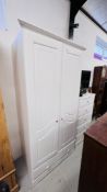 A MODERN WHITE FINISH THREE PIECE BEDROOM SUITE COMPRISING OF DOUBLE DOOR WARDROBE WITH SINGLE