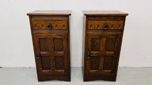 A PAIR OF GOOD QUALITY REPRODUCTION SINGLE DOOR SINGLE DRAWER CHESTS BY GRANGEMOOR