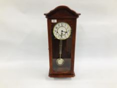 A REPRODUCTION WESTMINSTER CHIMING FENCLOCKS SUFFOLK WALL CLOCK WITH KEY AND PENDULUM.