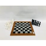 AN IMPRESSIVE ORIENTAL DESIGN CHESS BOARD AND HARDSTONE CHESS PIECES