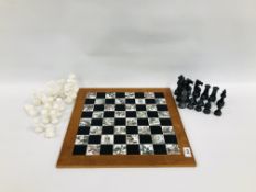 AN IMPRESSIVE ORIENTAL DESIGN CHESS BOARD AND HARDSTONE CHESS PIECES