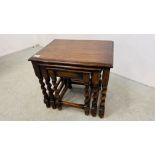 A NEST OF THREE OAK GRADUATED OCCASIONAL TABLES WITH BARLEY TWIST LEGS