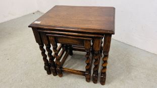 A NEST OF THREE OAK GRADUATED OCCASIONAL TABLES WITH BARLEY TWIST LEGS