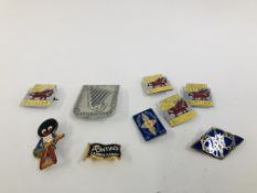 A GROUP OF FIVE ENAMELLED BUTLINS BADGES,