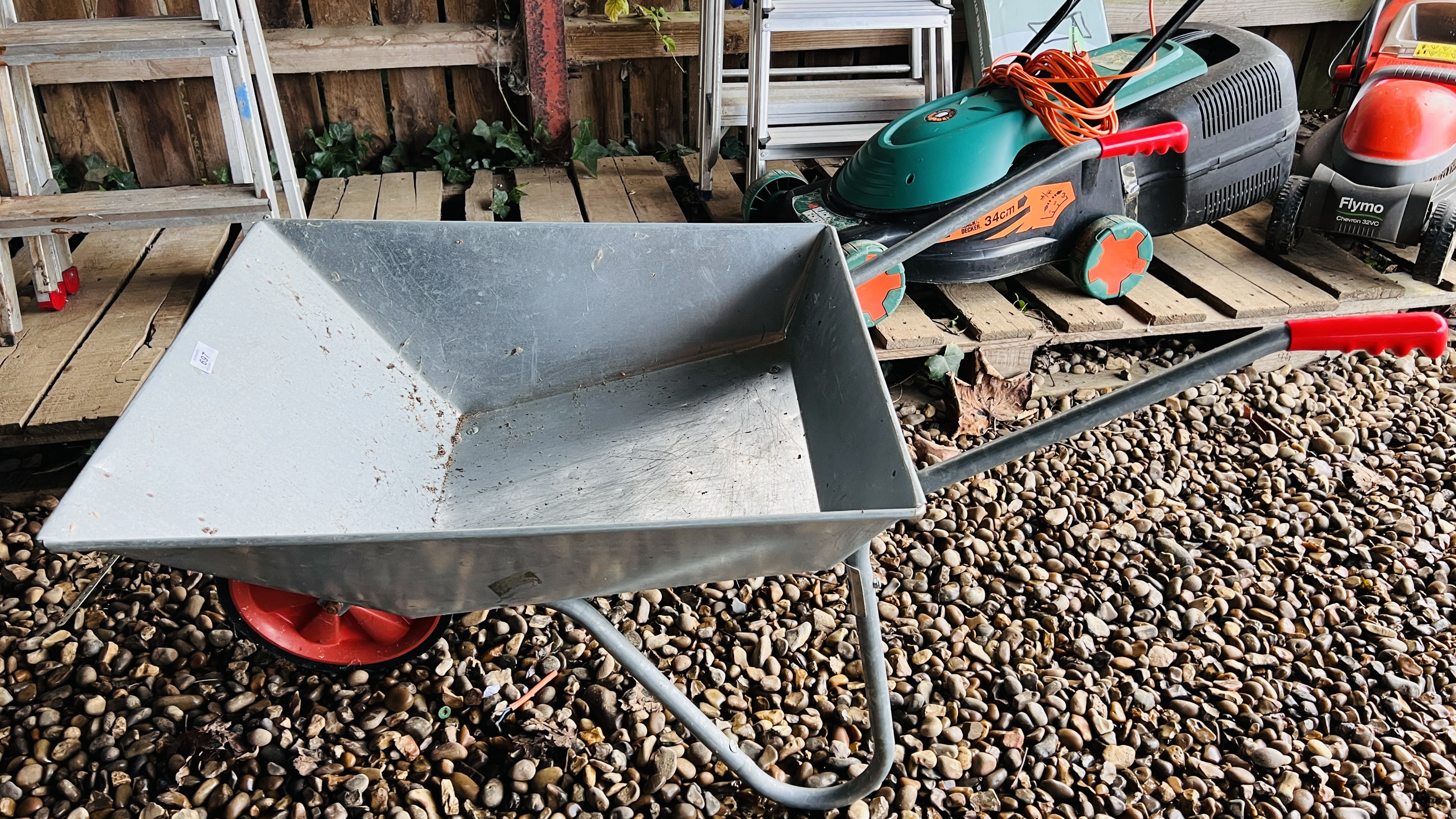 A GALVANISED GARDEN WHEEL BARROW