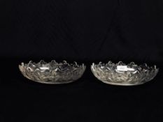 A PAIR OF LATE GEORGIAN OVAL CUT GLASS DISHES WIDTH 22CM.