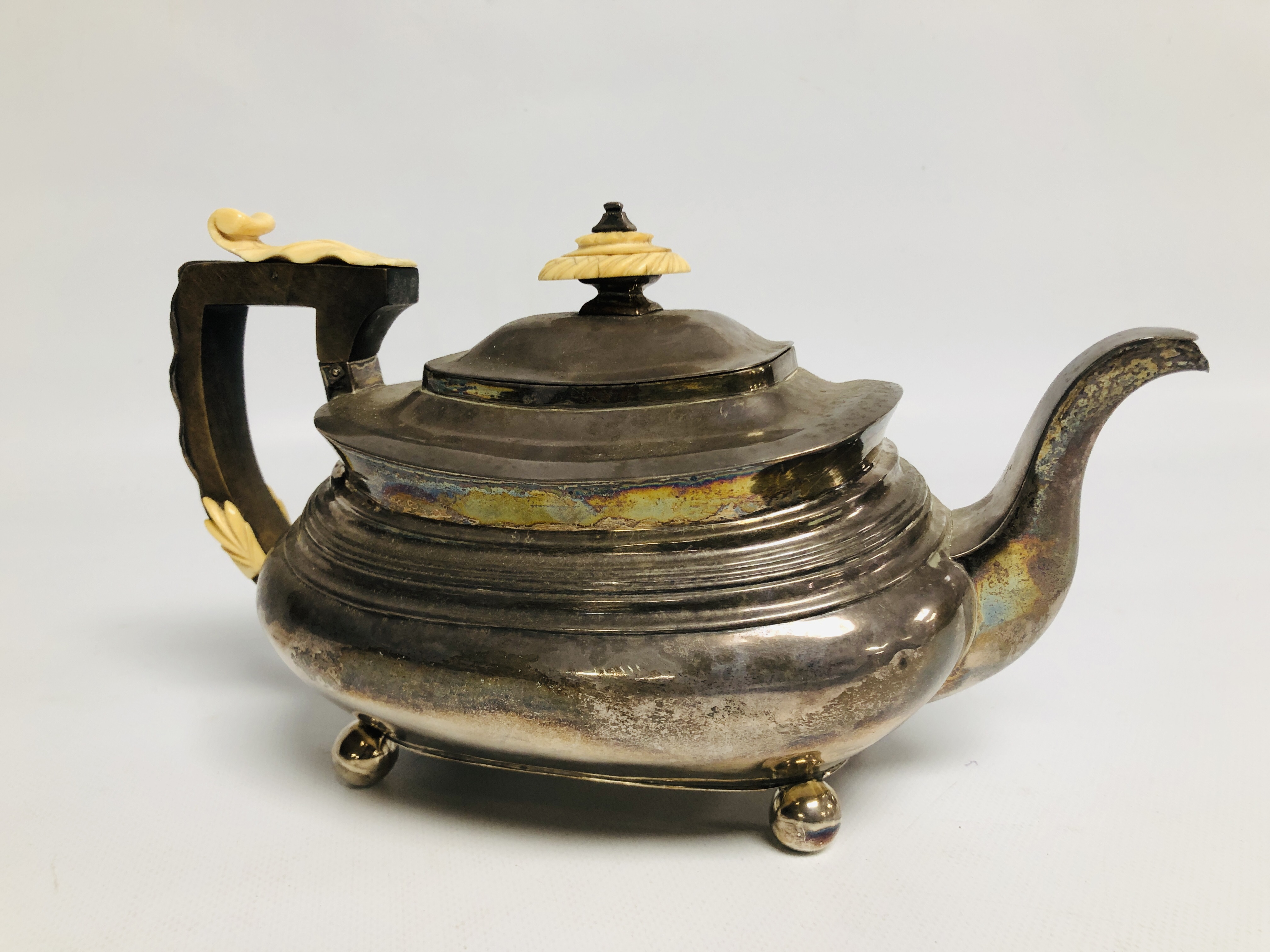 A GEORGE III SILVER TEAPOT, LONDON ASSAY OF COMPRESSED OVOID FORM ON BALL FEET. - Image 4 of 9