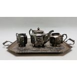 A CONTINENTAL WHITE METAL THREE PIECE TEASET ON TRAY ALL PROFUSELY DECORATED WITH ANIMALS AND