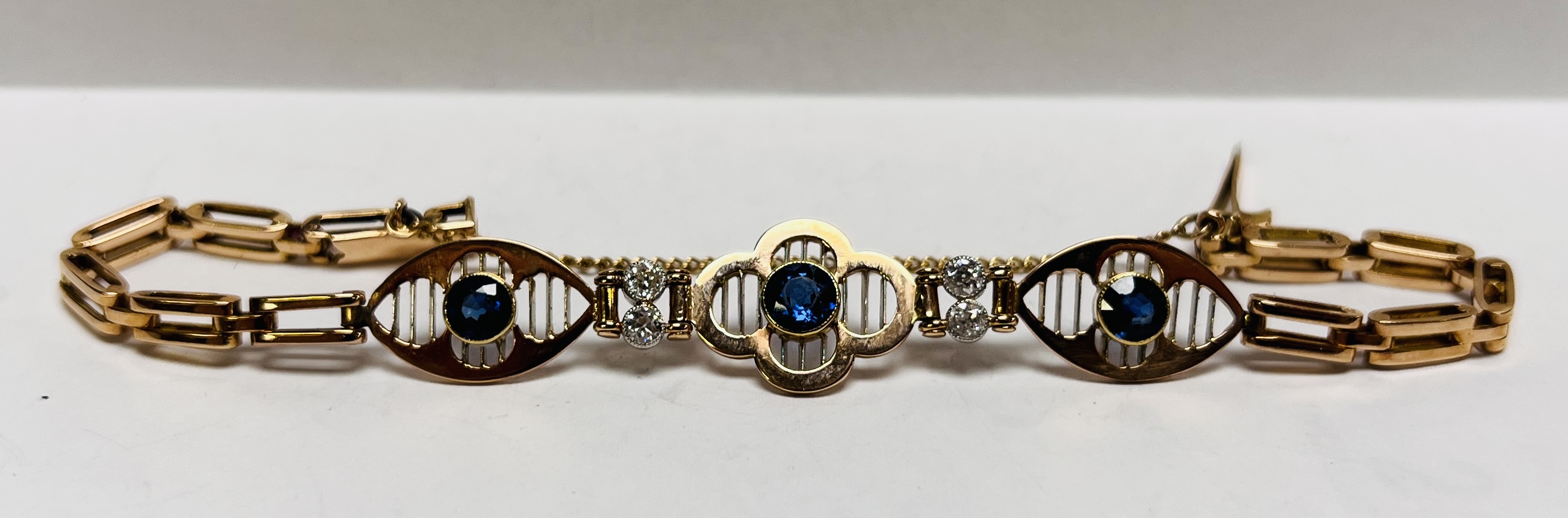 A VINTAGE DIAMOND AND SAPPHIRE BRACELET AND SAFETY CHAIN,