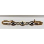 A VINTAGE DIAMOND AND SAPPHIRE BRACELET AND SAFETY CHAIN,