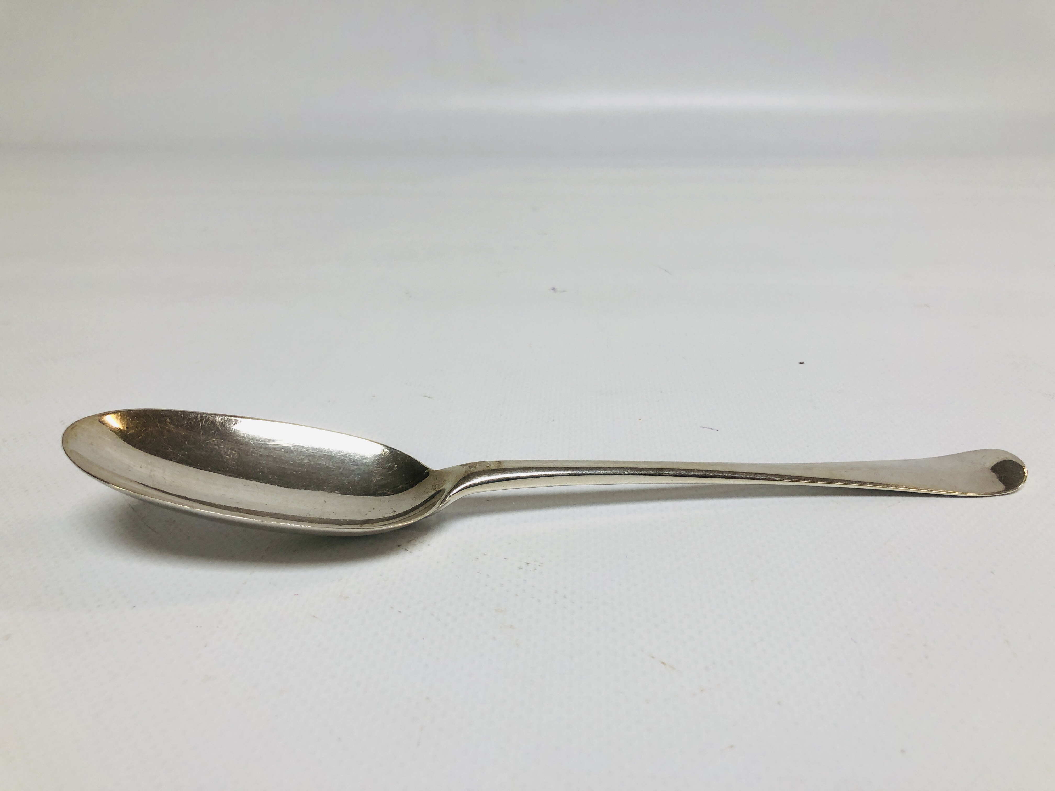 A GEORGE I SILVER HANOVERIAN PATTERN SERVING SPOON,