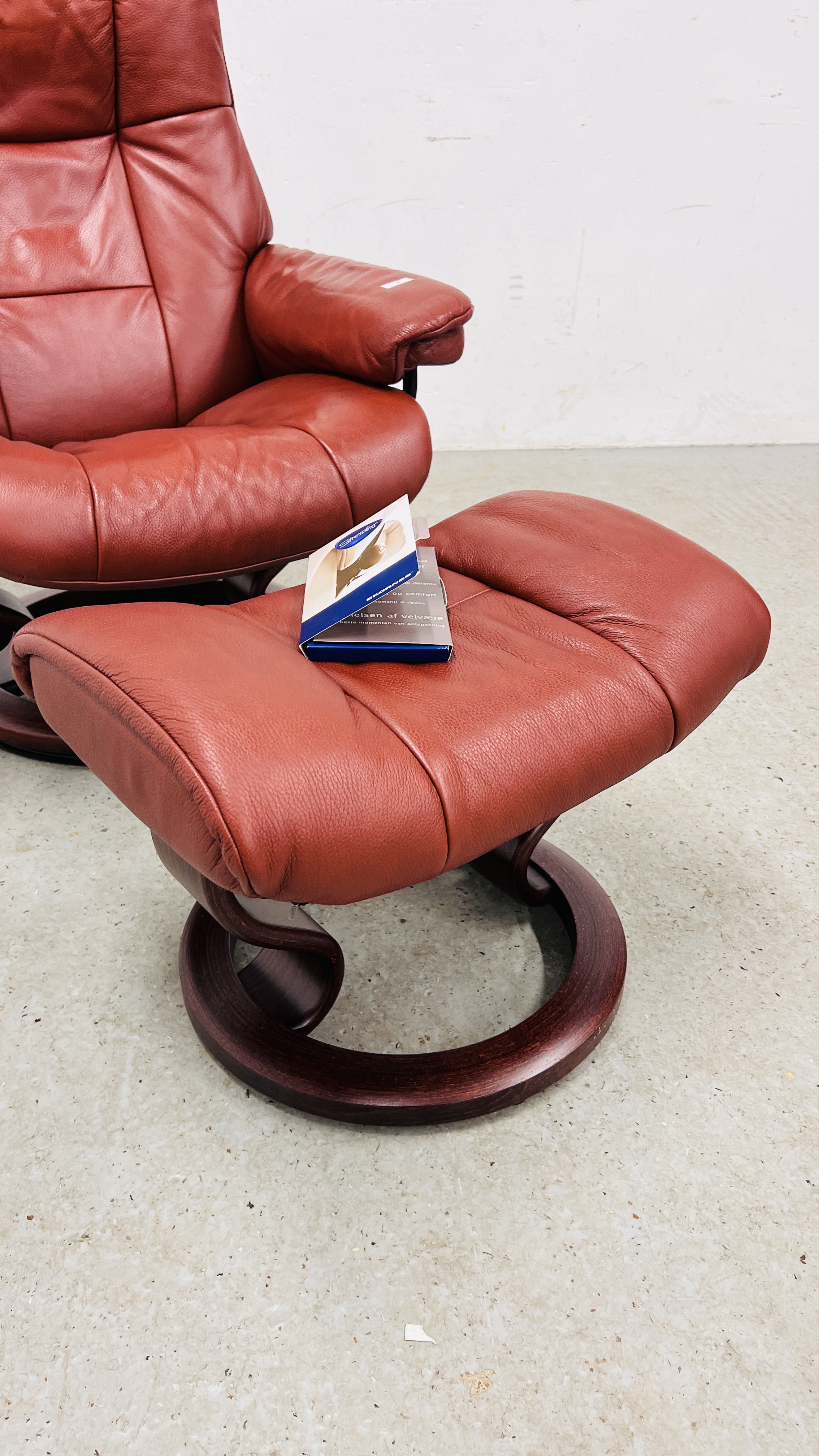 A GOOD QUALITY STRESSLESS RED LEATHER RELAXER CHAIR WITH MATCHING FOOTSTOOL. - Image 12 of 13