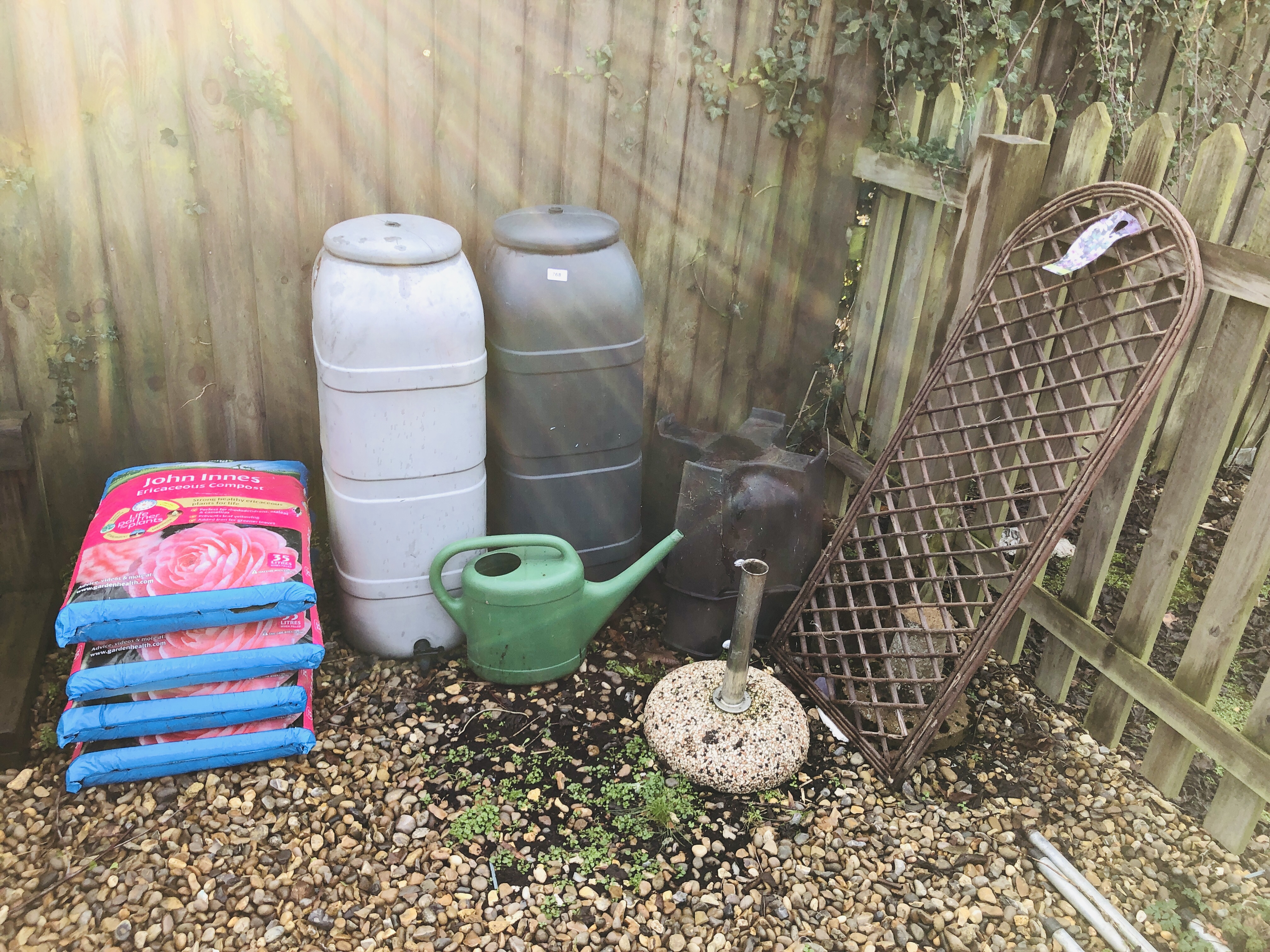 FOUR BAGS OF 35 LITRE JOHN INNES ERICACEOUS COMPOST, 2 X WATER BUTTS, PARASOL STAND, ETC.