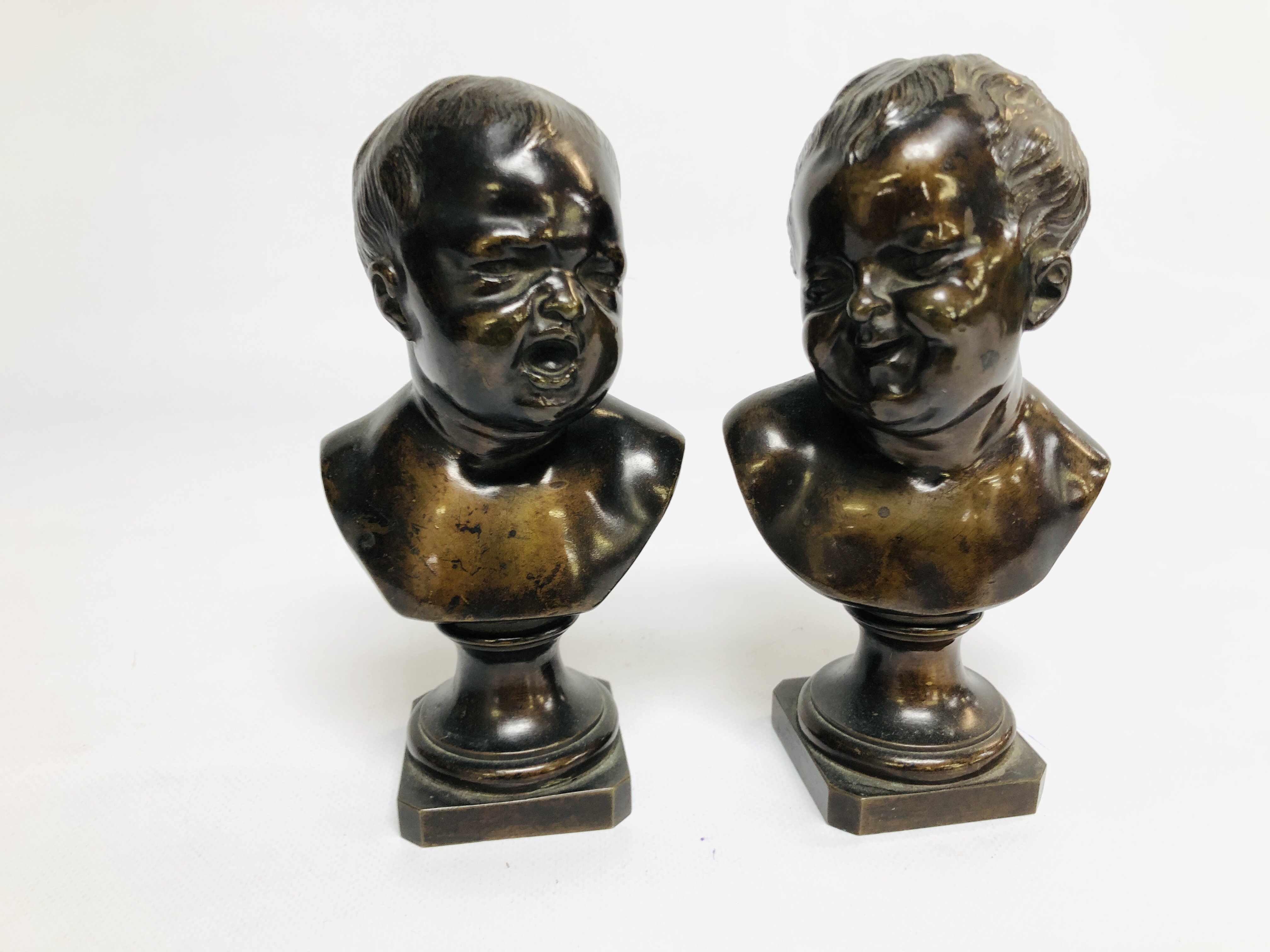 A PAIR OF BRONZE BUSTS OF CHILDREN, SIGNED CHARDIGNY HEIGHT 19CM.