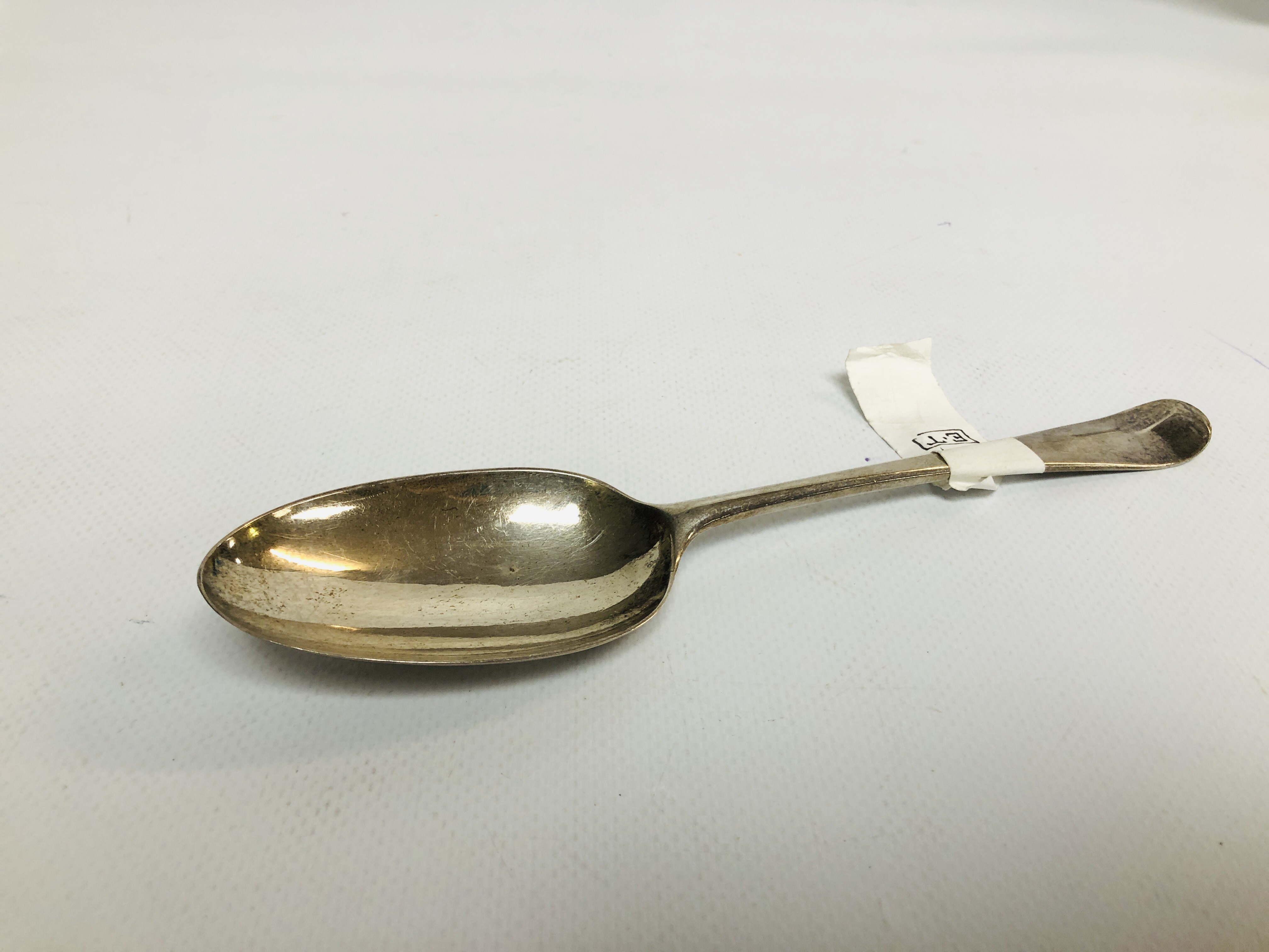 A GEORGE III SILVER HANOVERIAN PATTERN SERVING SPOON SCALLOP SHELL BACK PROBABLY BY ELIZABETH