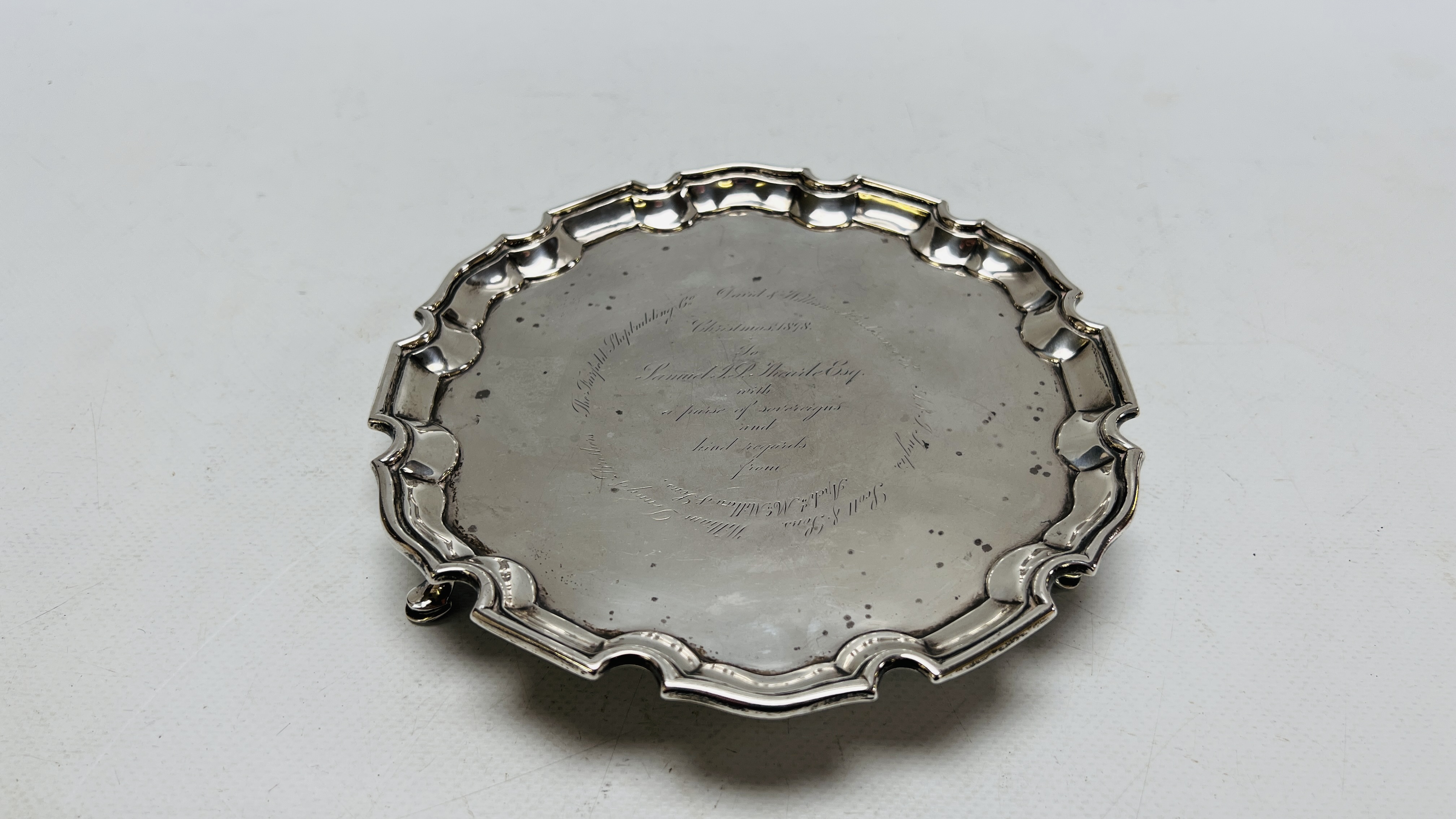 AN ANTIQUE SILVER SALVER GIFTED TO SAMUEL JAMES POPE THEARLE CHRISTMAS 1898, INSCRIBED.