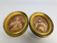 A PAIR OF C18th SEPIA PRINTS, A LADY AND A CHILD WITH A DRUM IN OVAL FRAMES, HEIGHT 25.5CM.