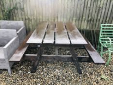 A SOLID WOOD GARDEN PICNIC BENCH