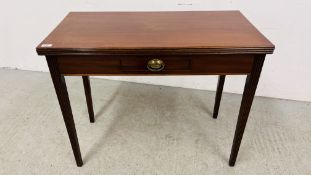 A GEORGE III FOLDING TEA TABLE ON REEDED TAPERING LEGS WIDTH 92CM.