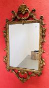 A GEORGE III GILT MIRROR WITH SCROLLED CRESTING AND APRON,