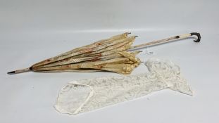 A VINTAGE SILK AND LACE UMBRELLA DECORATED WITH PINK ROSES,