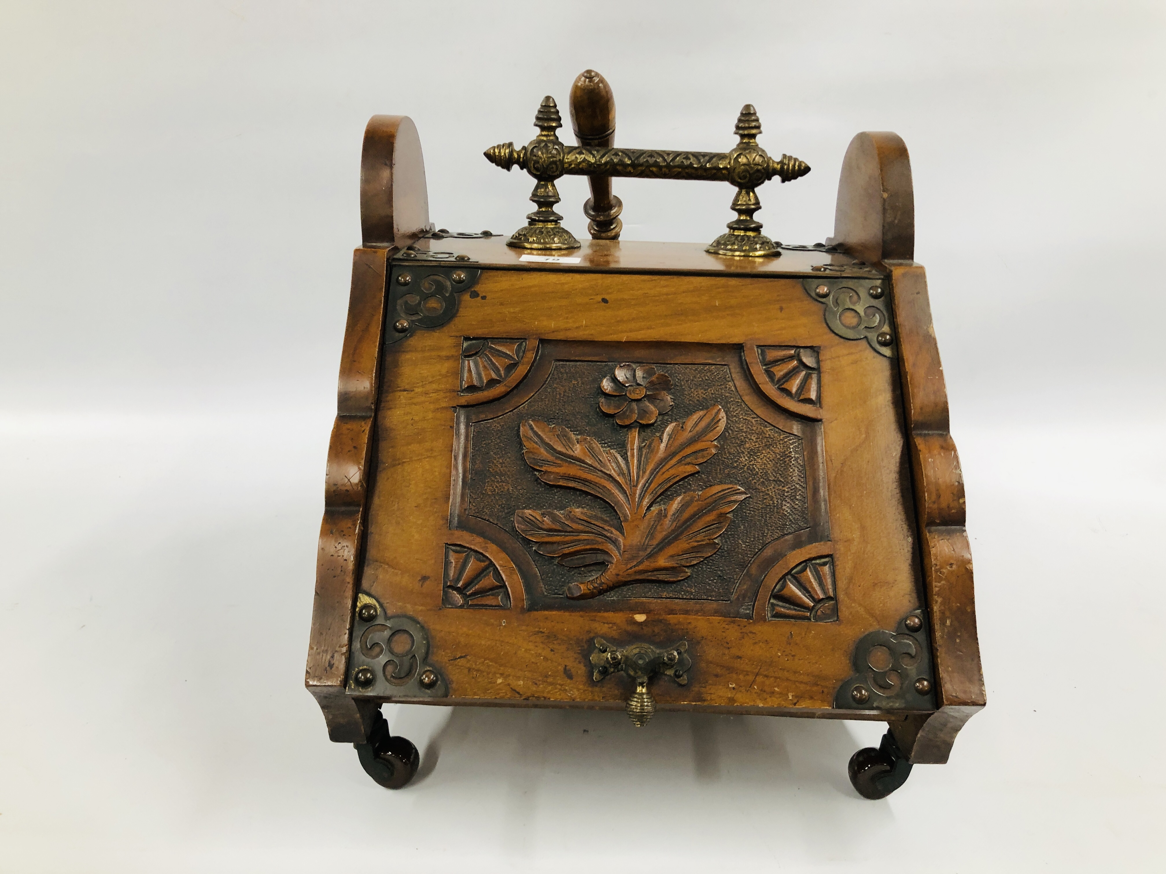 A WALNUT COAL BOX WITH CARVED PANEL DETAILING,