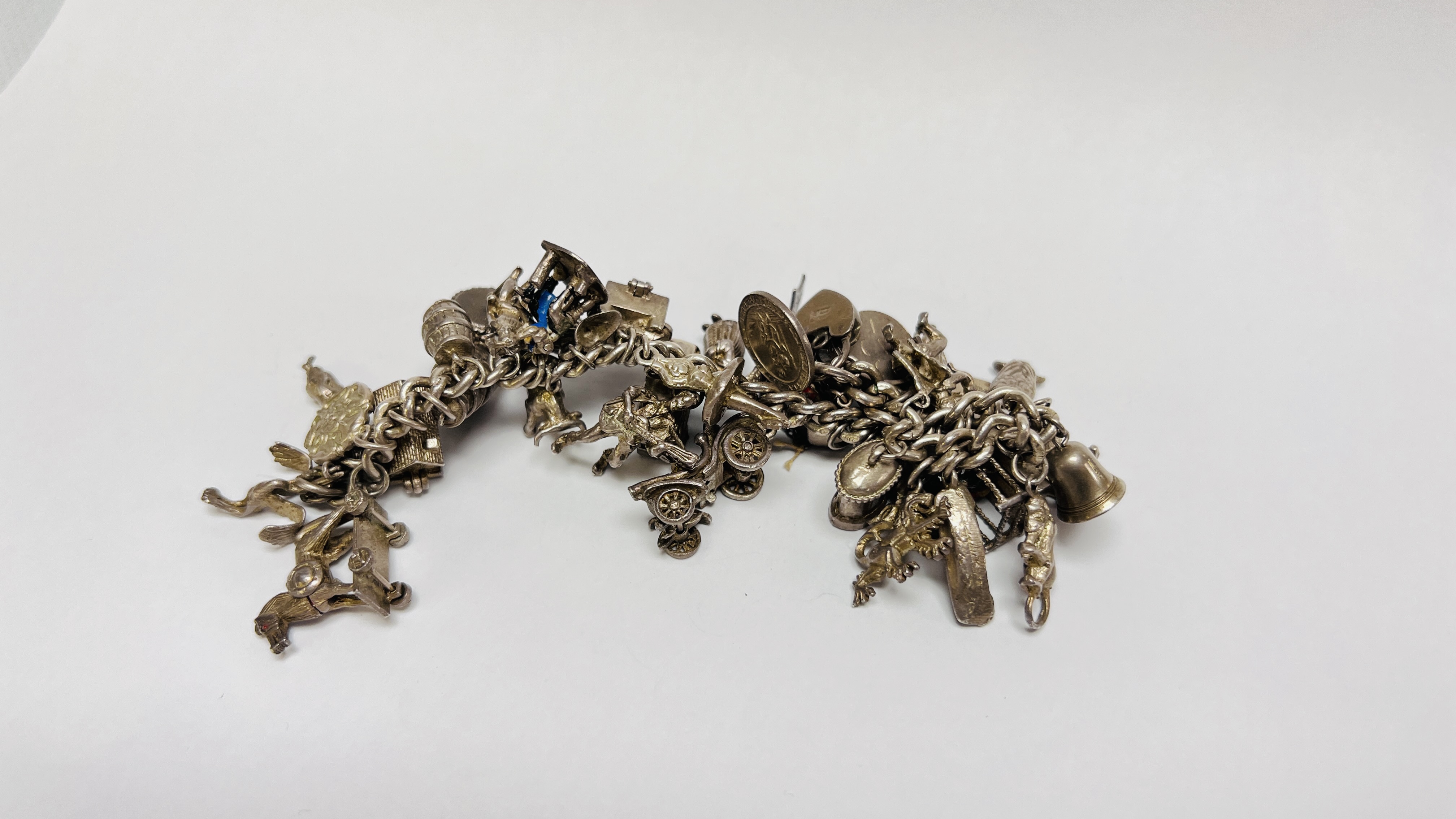 VINTAGE SILVER CHARM BRACELET PADLOCK CLASP WITH APPROX 35 SILVER AND WHITE METAL CHARMS - Image 5 of 8