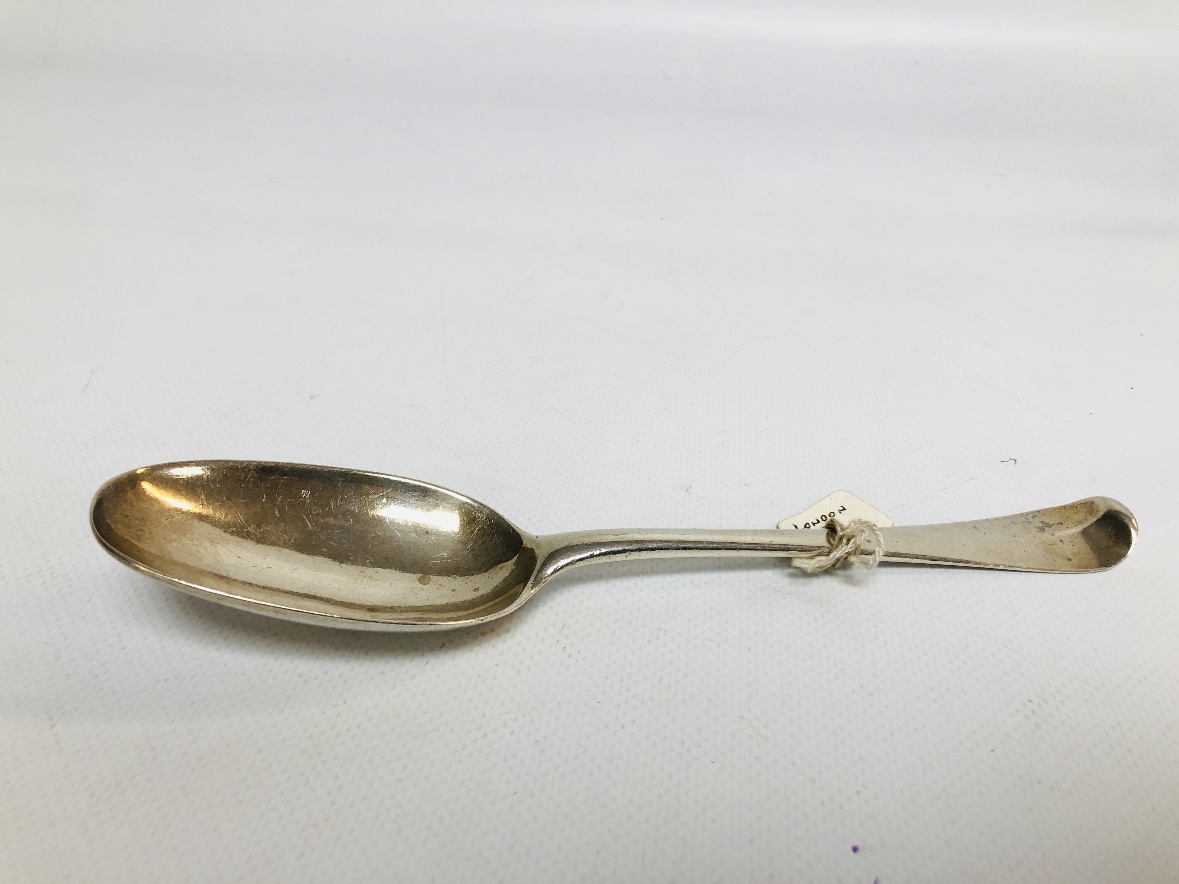 A GEORGE I HANOVERIAN PATTERN SILVER SERVING SPOON PROBABLY LONDON 1724