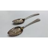 A PAIR OF SILVER SERVING SPOONS FLORAL DESIGN, LONDON ASSAY.