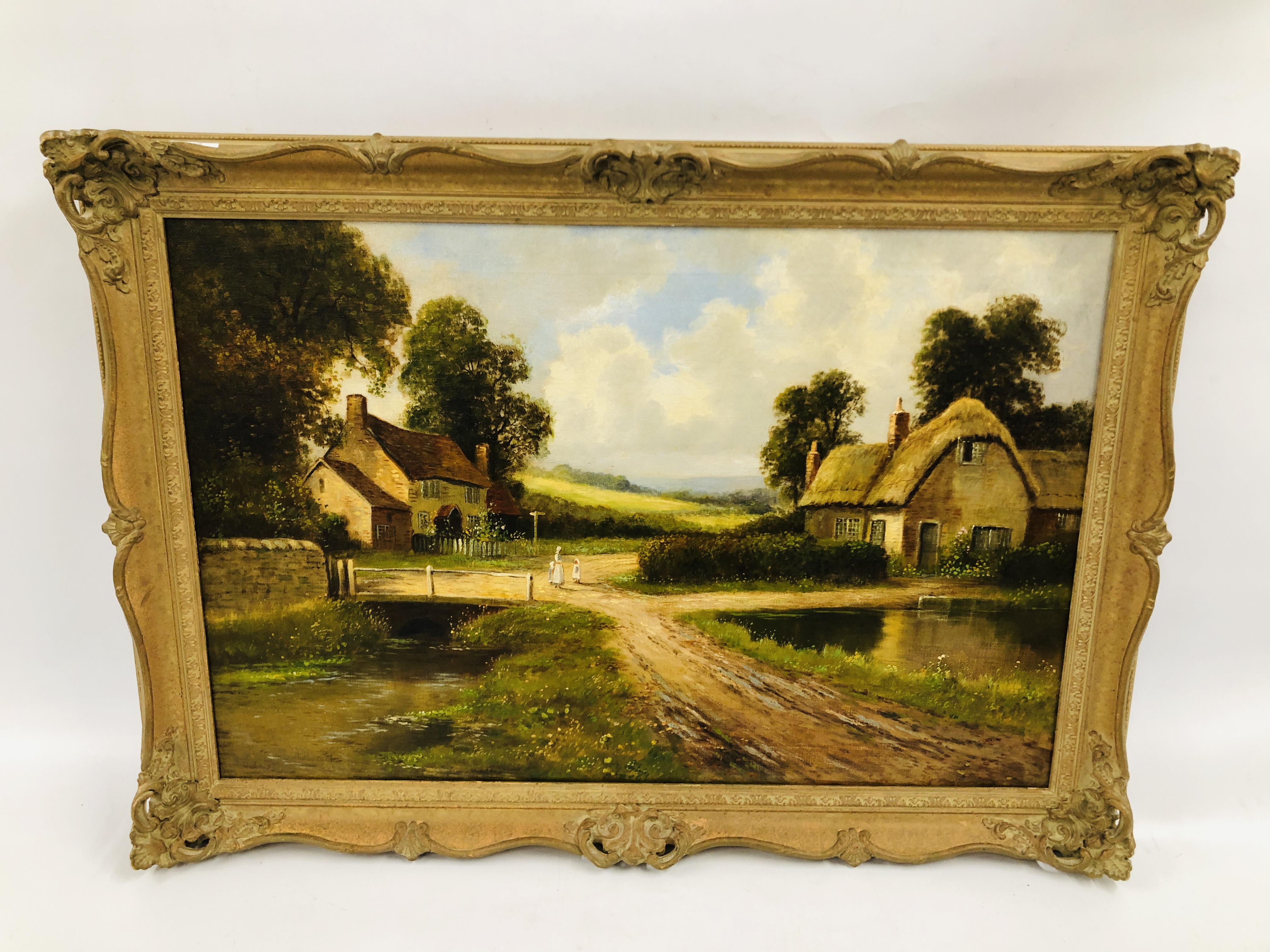 ORNATELY FRAMED OIL ON CANVAS "CROSSROADS WITH COTTAGES AND RIVER", NO VISIBLE SIGNATURE 48.