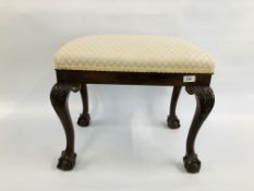 A C19th MAHOGANY RECTANGULAR STOOL ON CABRIOLE LEGS TERMINATING IN BALL AND CLAW FOOT.