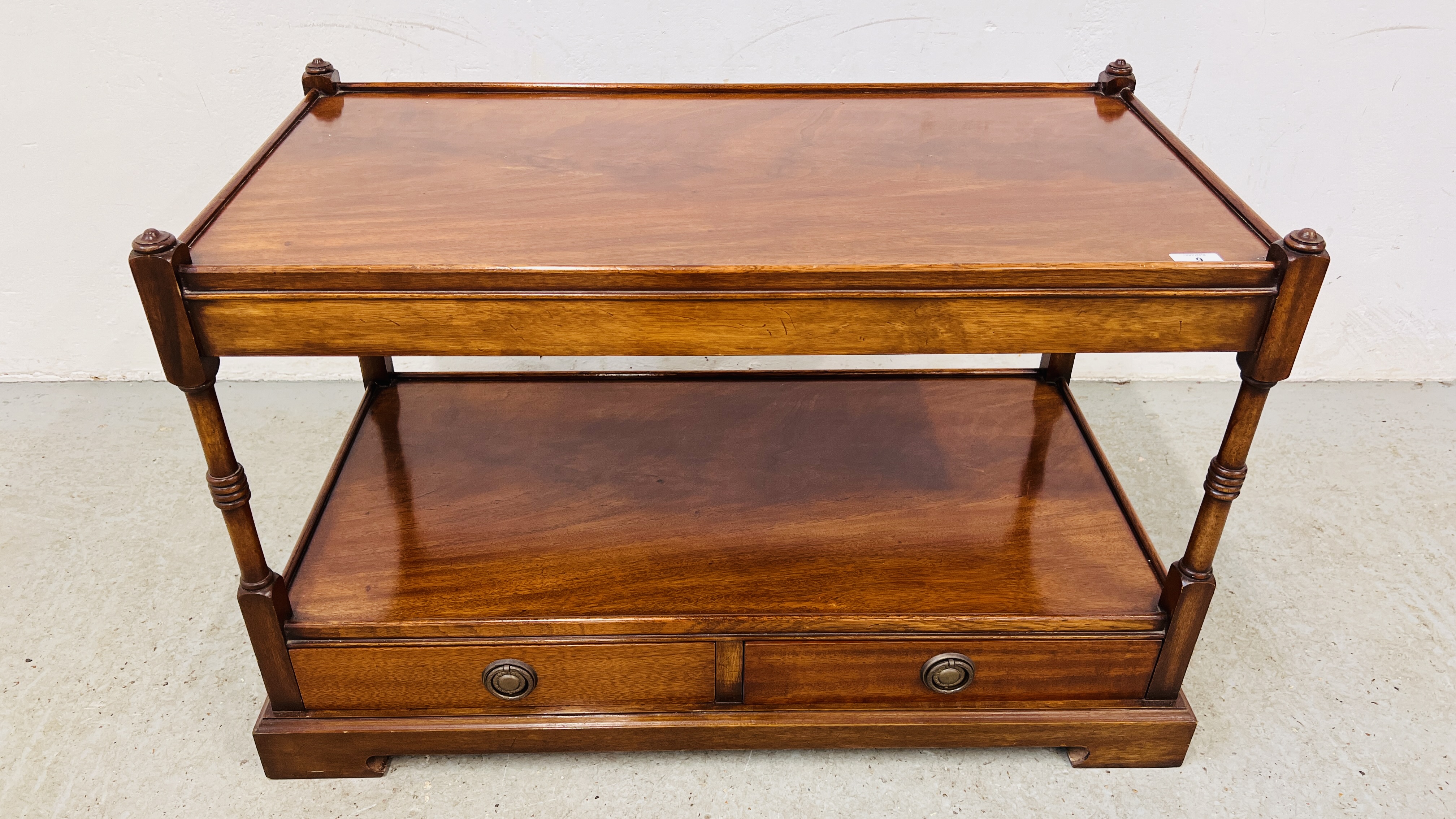 A REPRODUCTION TWO DRAWER, TWO TIER BUFFET / COFFEE TABLE WITH OPEN SHELF.