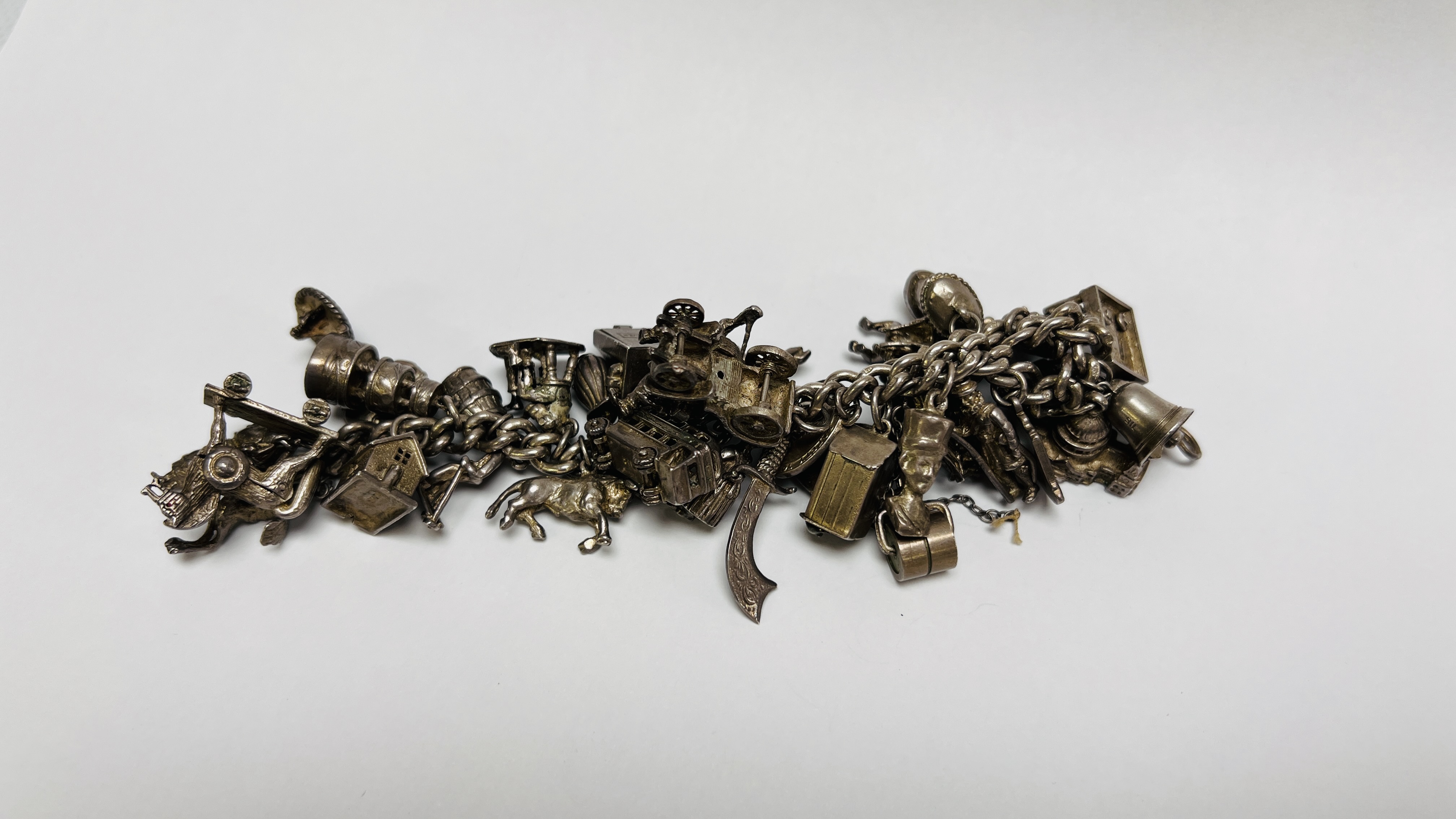 VINTAGE SILVER CHARM BRACELET PADLOCK CLASP WITH APPROX 35 SILVER AND WHITE METAL CHARMS - Image 2 of 8