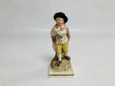 A PEARLWARE FIGURE OF A BOY, HEIGHT 20CM.