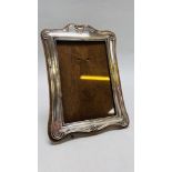 VINTAGE SILVER PHOTO FRAME ON WOODEN BACKING BIRMINGHAM ASSAY HEIGHT 20CM. WIDTH 14.5CM.