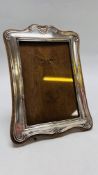 VINTAGE SILVER PHOTO FRAME ON WOODEN BACKING BIRMINGHAM ASSAY HEIGHT 20CM. WIDTH 14.5CM.