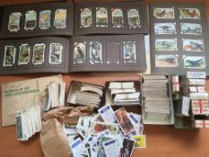 BOX OF CIGARETTE CARDS IN THREE ALBUMS AND LOOSE, ALSO BROOKE BOND CARDS, A FEW EMPTY PACKETS, ETC.