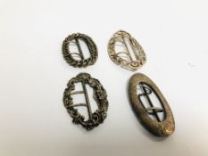 A GROUP OF FOUR SILVER OVAL BUCKLES ONE MARKED STERLING.