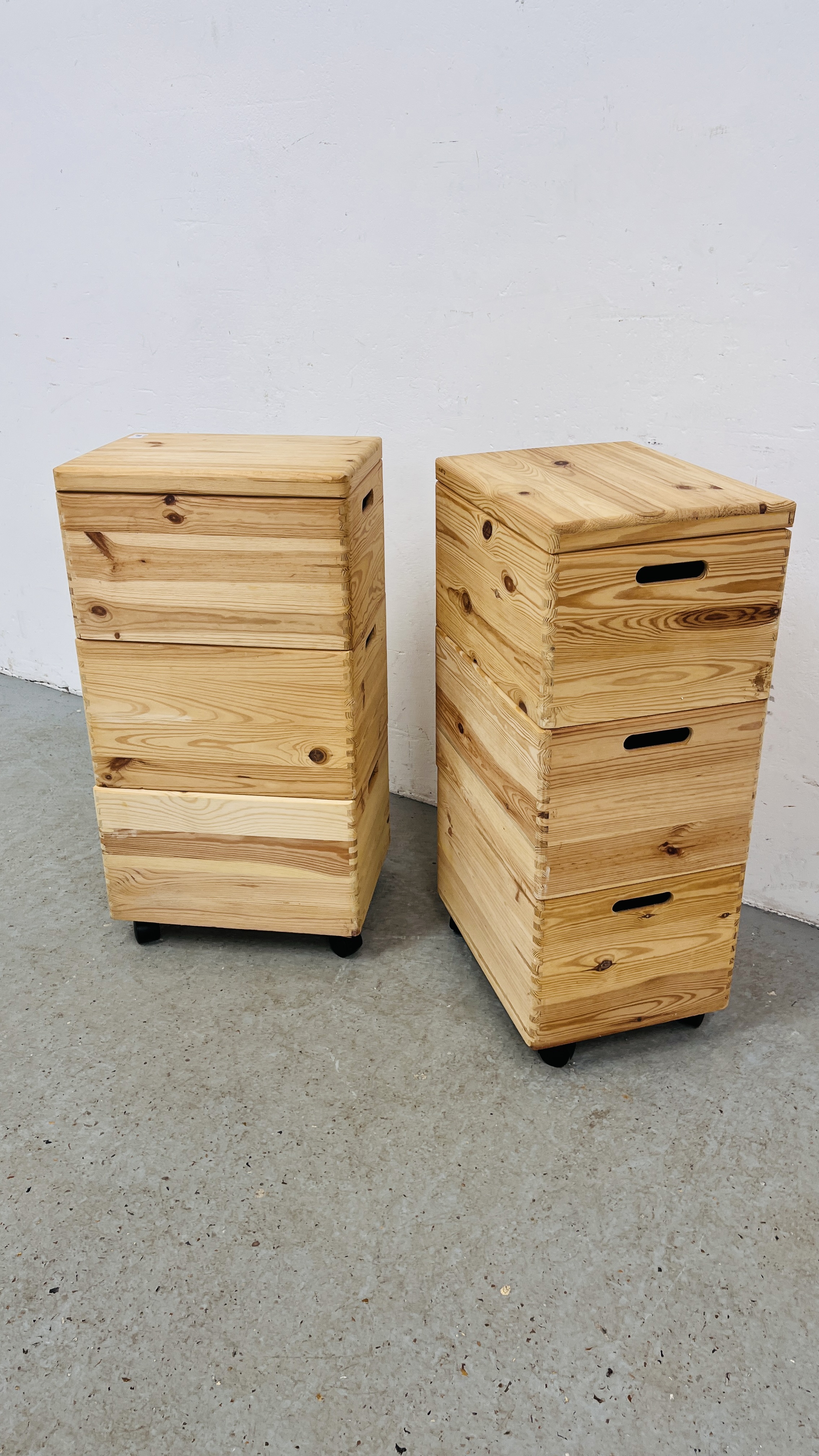A PAIR OF THREE SECTION PINE STAKING STORAGE BOXES, W 40CM, D 30CM, H 77CM.