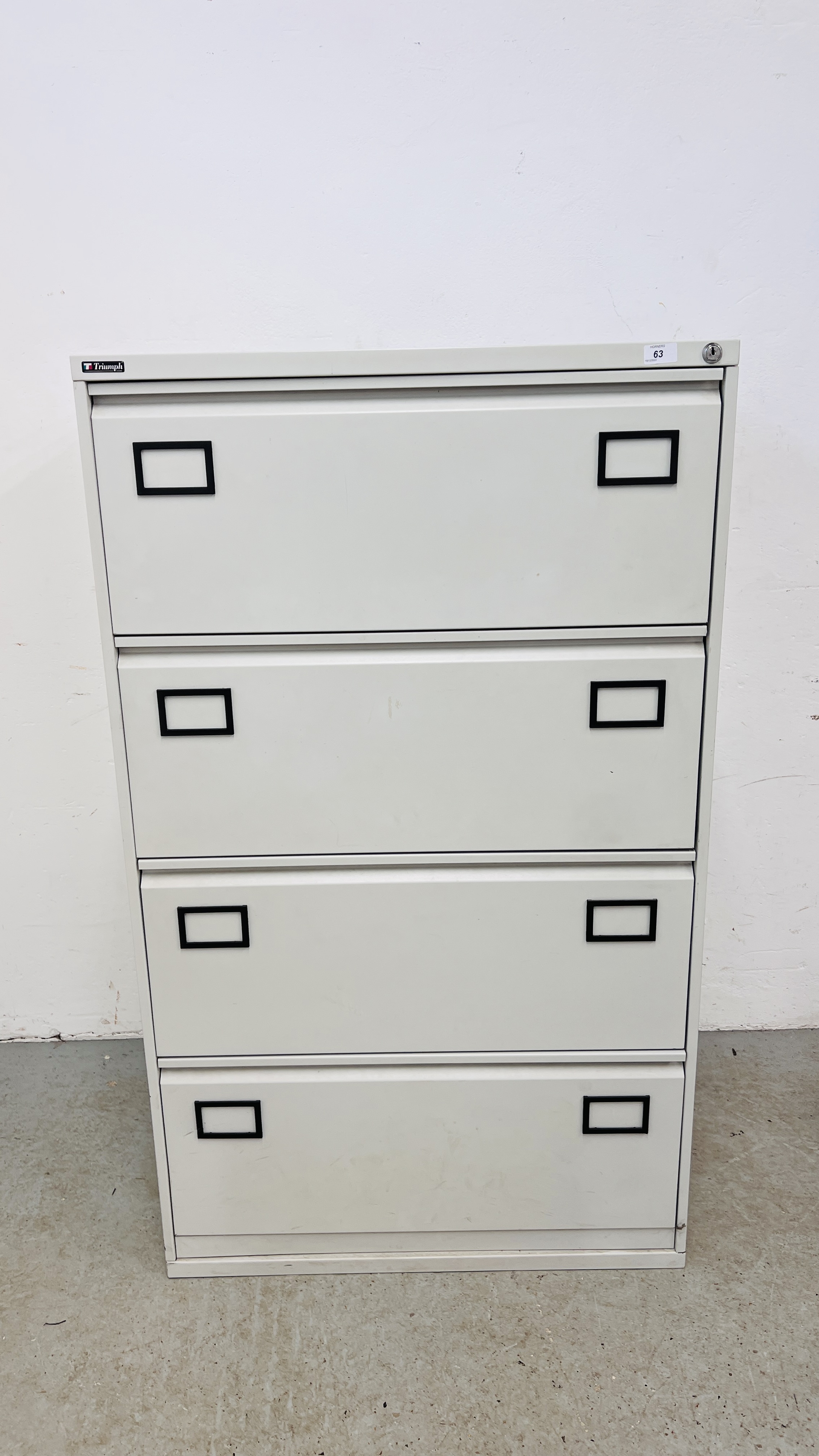 A GOOD QUALITY TRIUMPH METAL FOUR DRAWER FILING CABINET