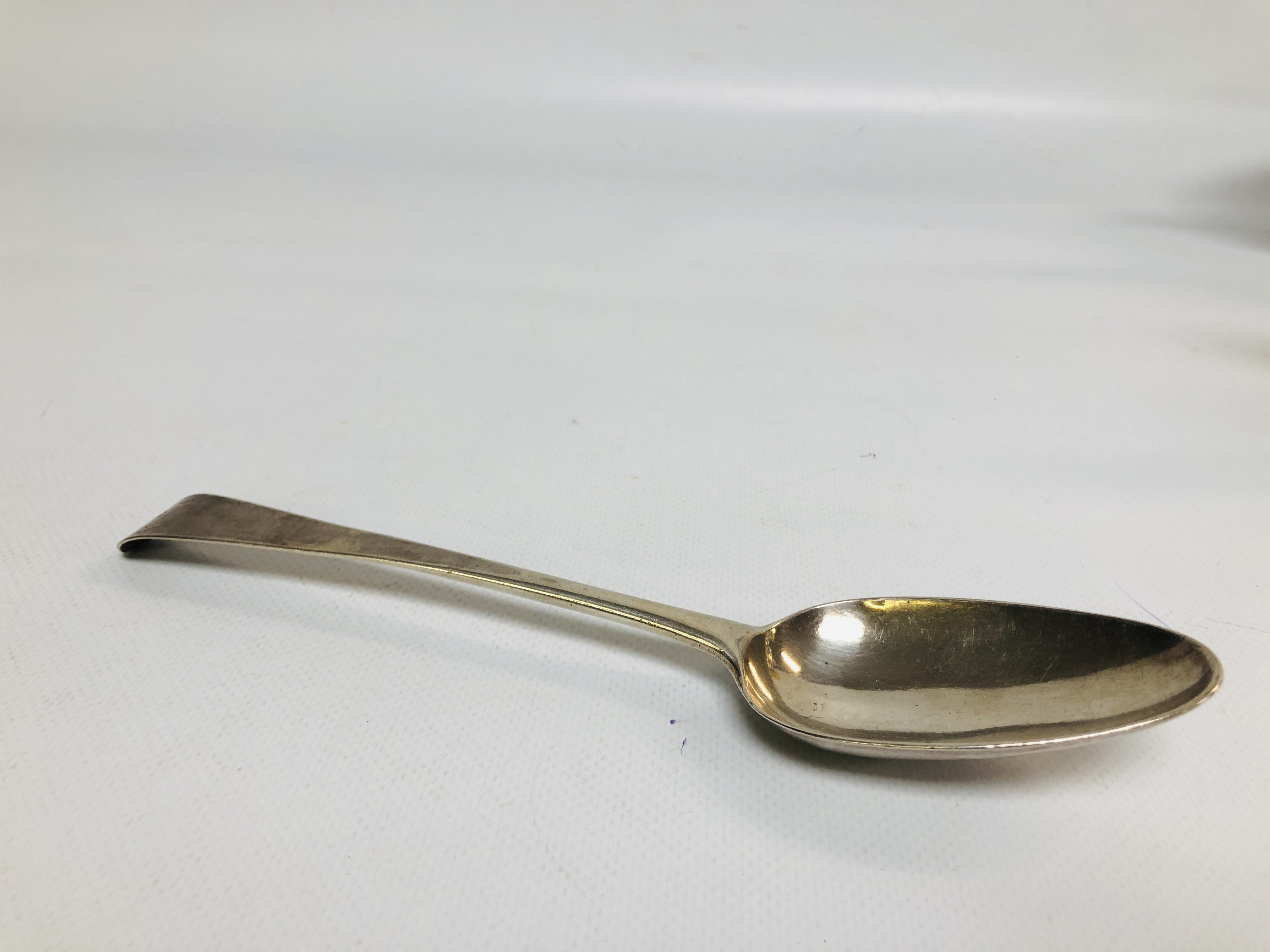 A GEORGE II SILVER OLD ENGLISH PATTERN SERVING SPOON,