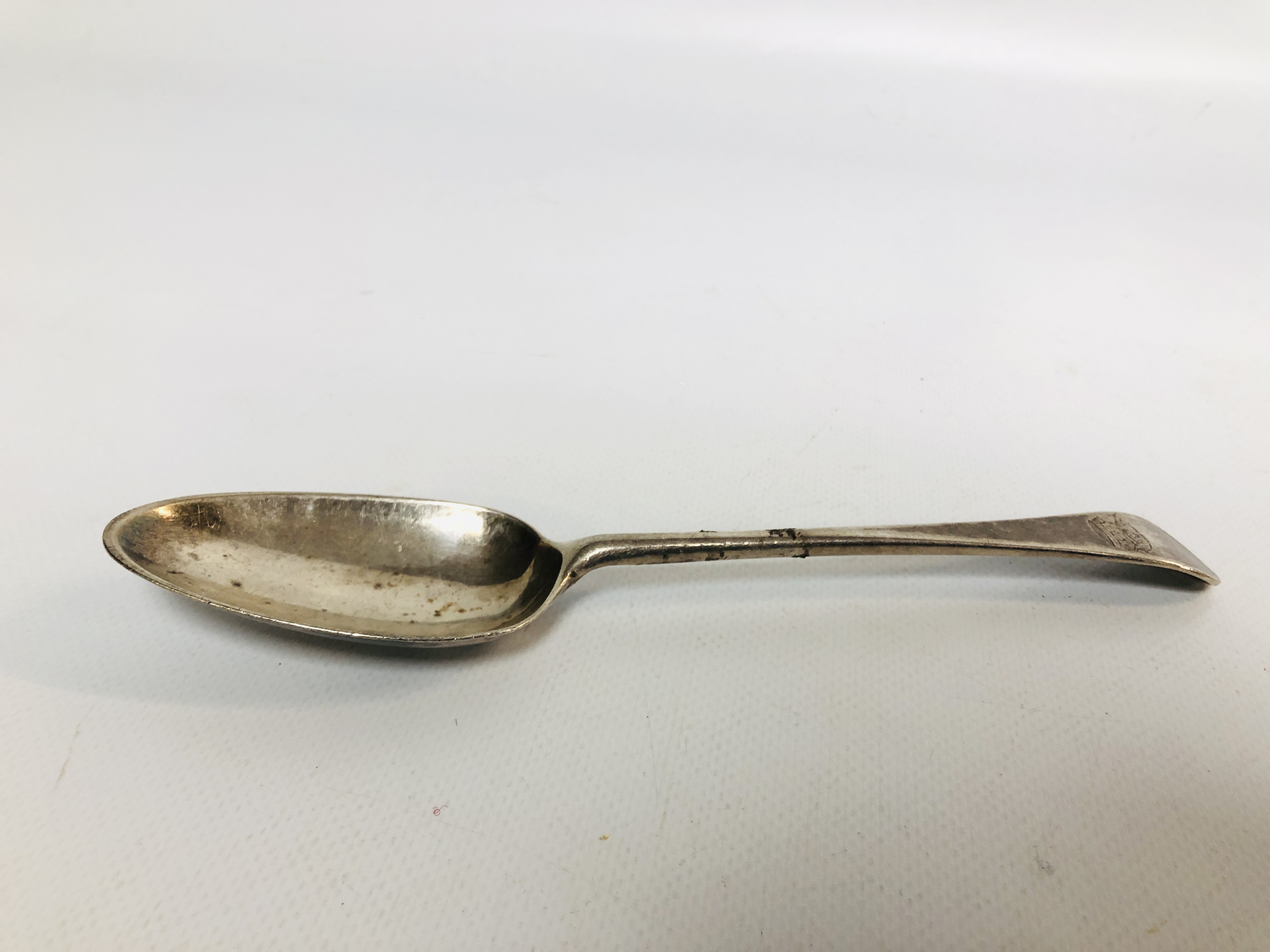 A GEORGE II SILVER OLD ENGLISH PATTERN SERVING SPOON,