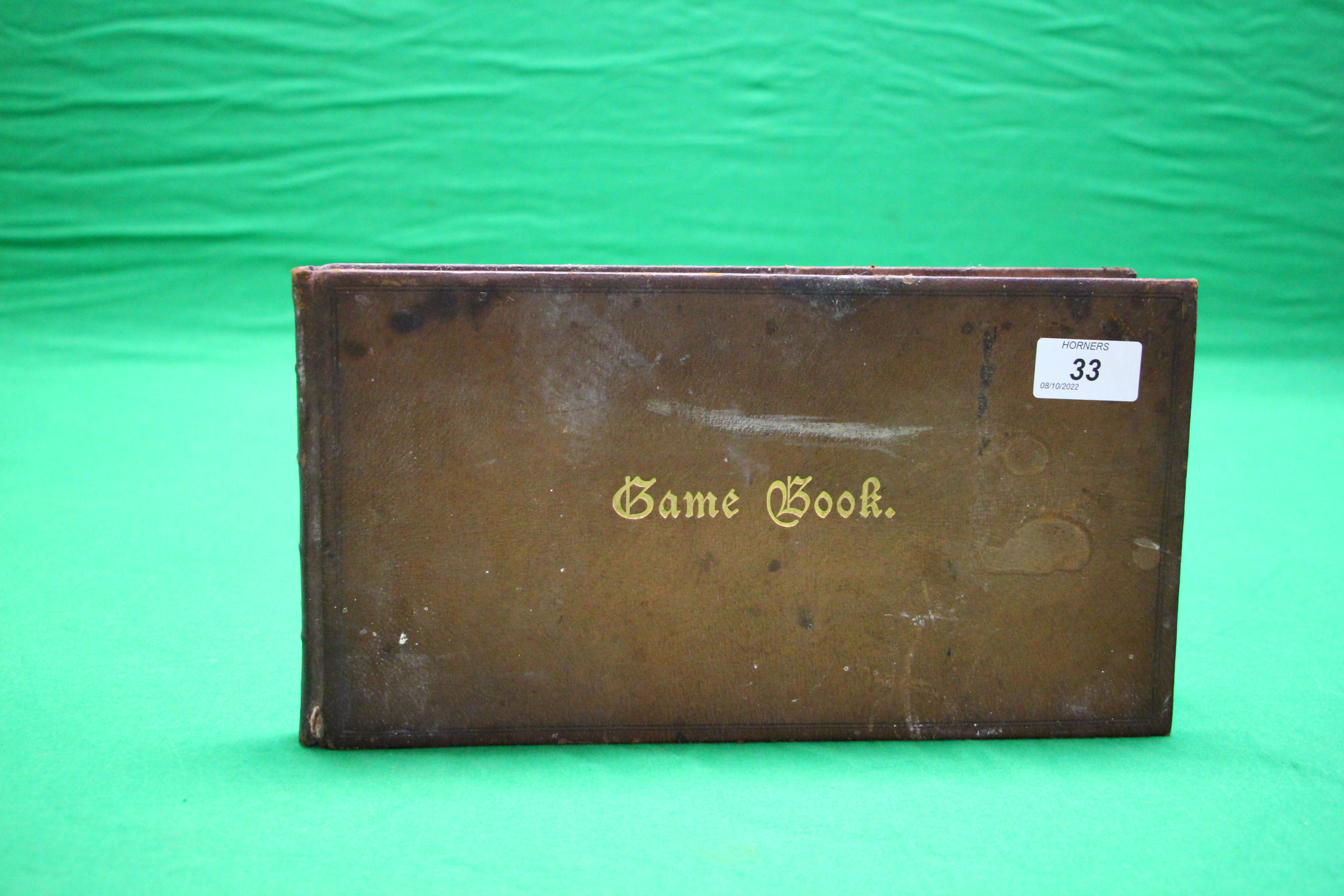 A VINTAGE LEATHER "GAME BOOK" LOG DATING BACK TO JULY 1918