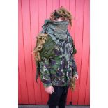 A CAMOUFLAGE GILLIE SUIT IN CANVAS CAMO BACK PACK