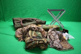A LARGE GREEN CANVAS DECOYING BAG ALONG WITH LIGHT WEIGHT FOLDING STOOL, CAMO HIDE NETS, HATS,