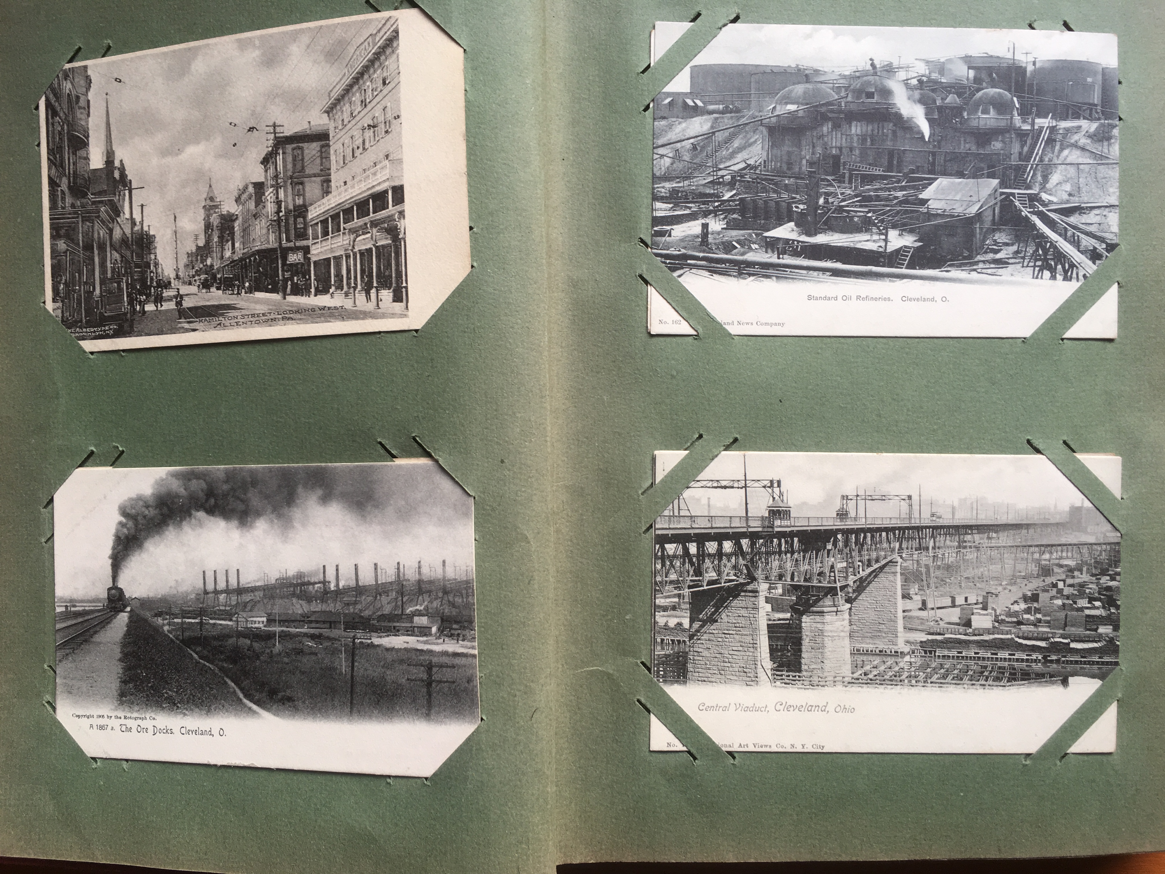 CORNER SLOT ALBUM WITH USA OR CANADA POSTCARDS, CLEVELAND, TITUSVILLE OILFIELDS, WAUPUCA RP (2),